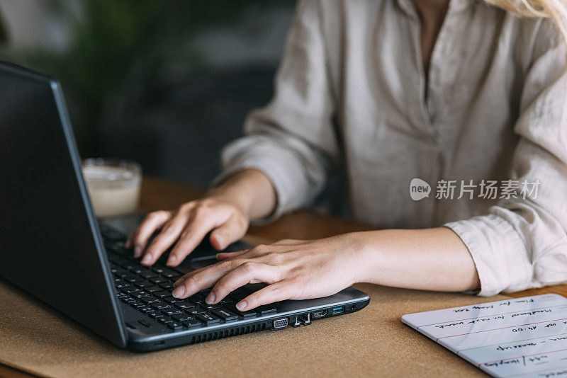 Unrecognizable Business Woman Working on Laptop Computer